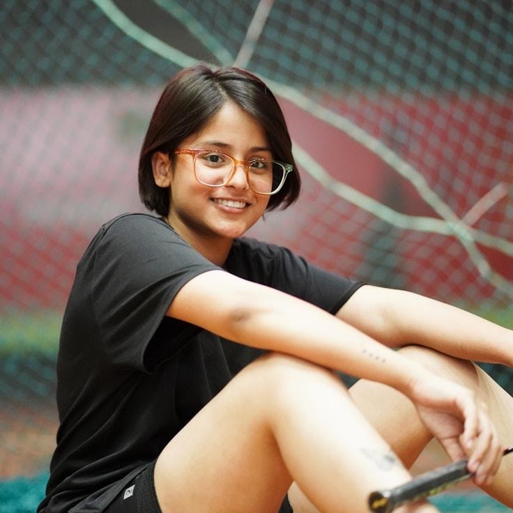 Mira Singh, Lead Design Curator at Adaptive Living Journey, reviewing corporate floral arrangements